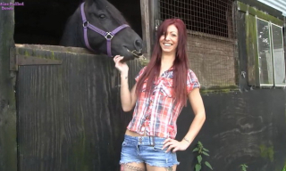 Red-haired Leanne Luv pulls her white panties down at the farm for some toy play