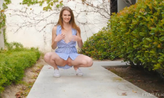 Sexy milf Ashley Lane rides up her dress outdoors for pantyless upskirt play