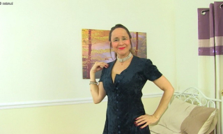 UK mature Josie exposes the tops of chic FF stockings and rubs her bushy pussy