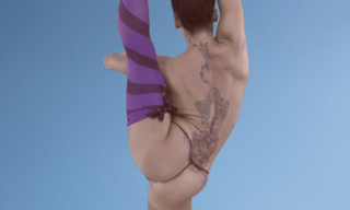 Tight UK dancer Kiki Devine showcases her stripy purple opaques with cute bows