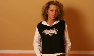 Curly German teenager in stripy stockings shows it all at a porn casting