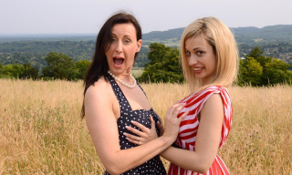 British nympho Lara Latex invites buxom blond nurse Chessie Kay to her den for a lesbo strapon ride