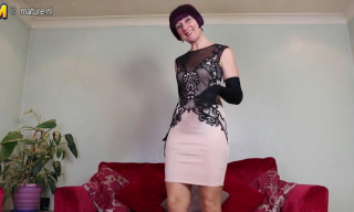 All dolled-up and gloved British mommy Penny Brooks strips to sheer stockings to rub her wet muff