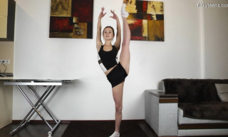Flexy gymnast Agata Berezka peels her sporty wear exercising just in white socks