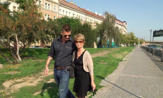 Lusty older lady Romana opens her stocking-clad legs for her much younger date