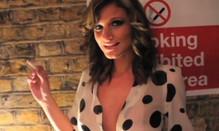 Sexy smoker Daisy Lynn shows off her boobs and strips to her black holdups