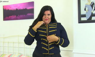 Curvaceous UK mommy Katie Coquard in lace-up boots and gartered stockings plays with her wet panties